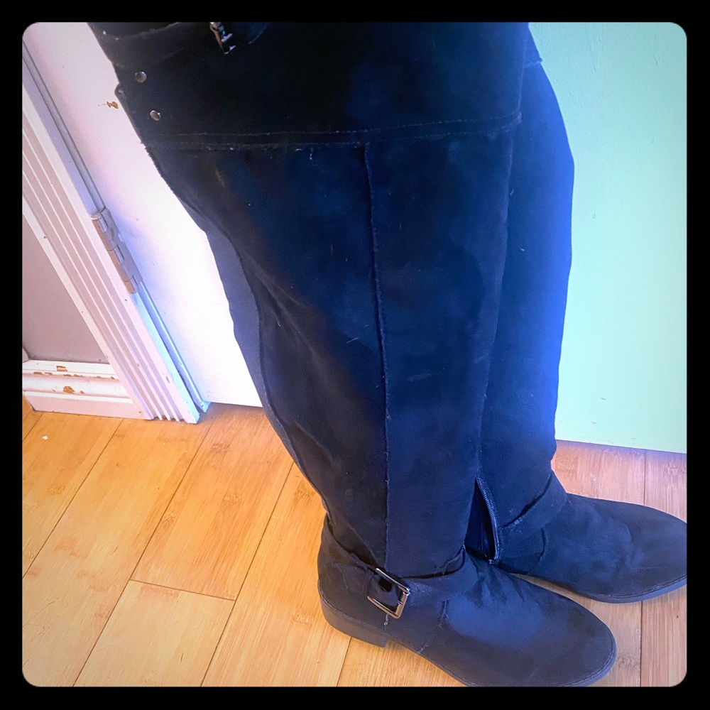Torrid wide calf, knee high black boots.